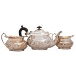 An Edwardian matched silver three-piece batchelor's tea service maker Harrison Brothers & Howson,