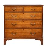 An 18th century oak rectangular chest: the top with a moulded edge,