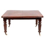 A Victorian mahogany extending dining table:, with a telescopic action,