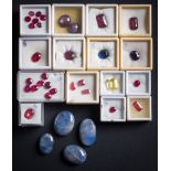 A collection of natural and simulated loose gemstones to include an oval star sapphire: