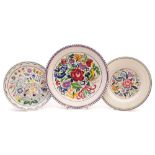 Three Poole Pottery dishes: decorated after a design by Truda Carter comprising two painted in the