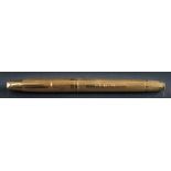 An 18ct gold engine turned 'Sheaffer' fountain pen: initialled 'A.C.