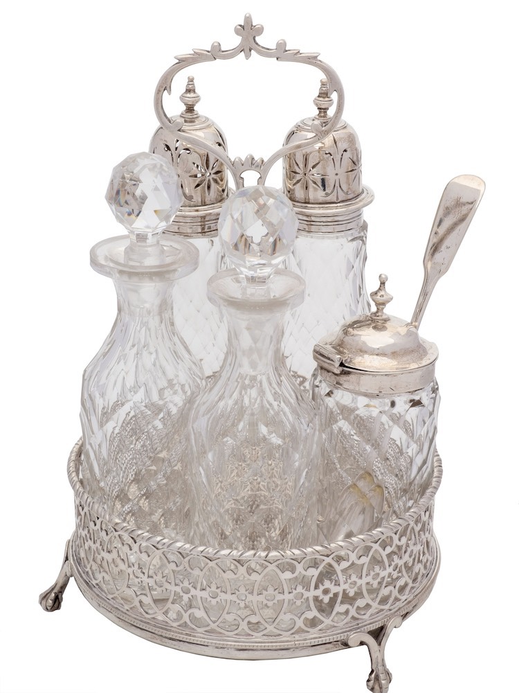 A 19th century silver circular five bottle cruet: the stand with indistinct maker's marks,