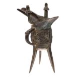 A Chinese bronze tripod wine vessel, Jue: with long spout,