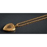 A 9ct gold heart-shaped pendant locket: on belcher-link chain stamped '9c', approximately 9.