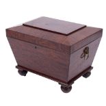 A Regency mahogany sarcophagus shaped cellarette:, with a hinged top and interior divisions,