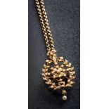 A seed pearl mounted oval pendant/brooch of pierced wreath design: suspending a pearl two-stone