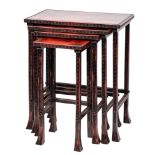 A set of Chinese scarlet and black variegated quartetto tables: the rectangular tops with Greek key