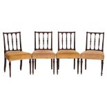 A set of four early 19th Century mahogany dining chairs:,