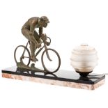 An Art Deco style bronze lamp: surmounted by a bronze racing cyclist,