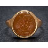 A Roman cornelian intaglio mounted seal ring: the intaglio possibly depicting the Roman god Cupid