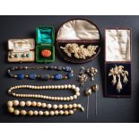 A collection of antique jewellery items to include: a pair of citrine mounted single-stone pins in