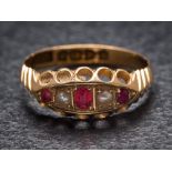 An 18ct gold, ruby doublet and seed pearl five-stone ring: Chester assay marks to shank,