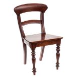 An apprentice's style mahogany dining chair in the Georgian taste: with rail back above a solid