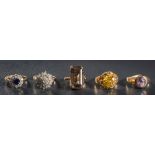 Five various stone-set rings: to include a 9ct gold illusion-set diamond cluster ring and a