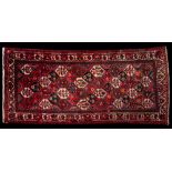 An Afghanistan rug:, the red, indigo,