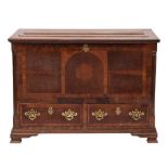 An 18th Century oak and walnut crossbanded Dower chest: the rectangular hinged top with a