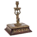 A 19th century boulle work and brass taperstick: the urn-shaped nozzle with foliate decorated drip