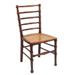 An Arts & Crafts mahogany side chair: with bobbin-turned five-bar back and cane seat,