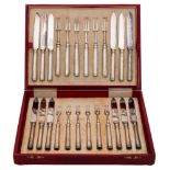 A set of twelve George V silver handled dessert knives and twelve matching forks,