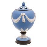 A 'Wedgwood' blue and white jasperware urn and pierced cover: with relief ribbon-tied drapery swag,