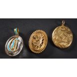 A 19th Century gold oval locket: with engraved strapwork decoration,