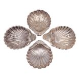 Four assorted silver butter dishes, various makers and dates: of shell-shaped outline,