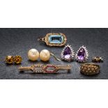 A 9ct gold, ruby and diamond bar brooch, a pair of amethyst and diamond pear-shaped ear studs,