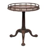 A mid 18th century mahogany circular silver table: with a baluster turned galleried top,