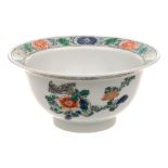 A Chinese porcelain bowl: of circular form with everted rim painted in the famille verte palette