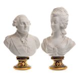 A pair of bisque porcelain busts: of Louis XVI and Marie Antoinette modelled in the white set on
