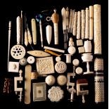 A group of 19th and early 20th Century ivory sewing accoutrements: includes bodkin cases,