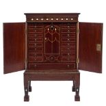 A collectors 19th Century mahogany and inlaid cabinet:, bordered with boxwood,
