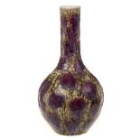 A Chinese green and flambe glazed bottle vase: decorated overall with lavender splashes on a