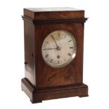 John Moore & Sons, Clerkenwell, London, a mahogany library clock: the eight-day duration,