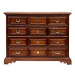 An 18th Century Italian provincial walnut commode:, of large size, the top with a moulded edge,