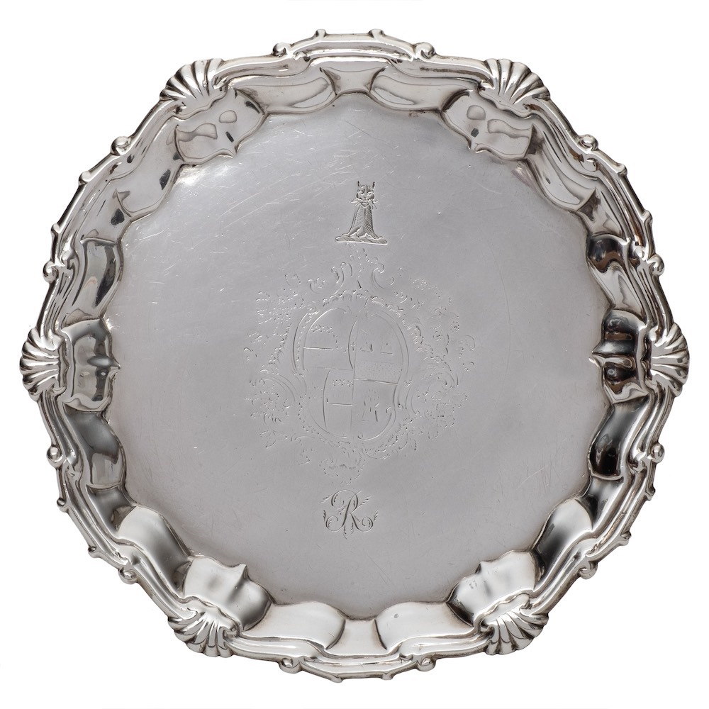 A pair of George II silver waiters, maker William Peaston, London, 1751: crested and initialled,