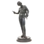 A Grand Tour bronze of Narcissus: raised on a circular base, after the antique found in Pompeii,