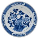 Two Chinese blue and white dishes: one painted with a large phoenix, rockwork and peonies,