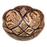 An Iranian pottery bowl: of deep circular form with lobed rim,