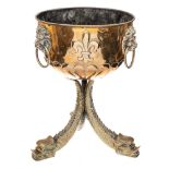 A Continental brass jardiniere: the circular bowl, with half reeded decoration,