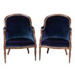 A pair of simulated rosewood tub-shaped bergere armchairs:, with upholstered backs,