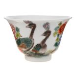 A small Chinese famille rose bowl: with flaring rim, painted with two peacocks amongst peony,