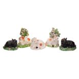 A group of five small Derby porcelain models of sheep: including two with bocage backgrounds,