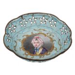 An 18th century Continental enamel dish: of lobed outline with central portrait cartouche of a lady,