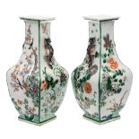 A pair of Chinese famille verte vases: of square baluster section with dragon handles,