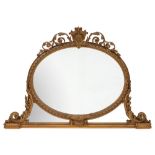 A Victorian later gilt gesso oval overmantel mirror:,