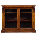 A Victorian burr walnut low bookcase:, of recessed breakfront outline, the top with a moulded edge,