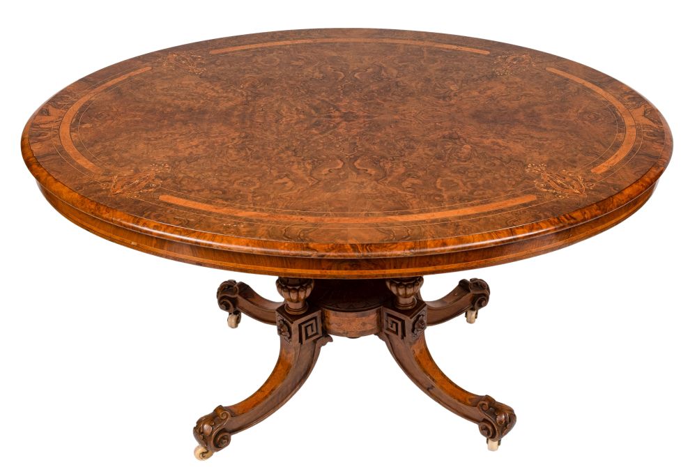 A Victorian walnut, banded and inlaid oval breakfast table:,