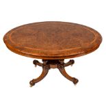 A Victorian walnut, banded and inlaid oval breakfast table:,